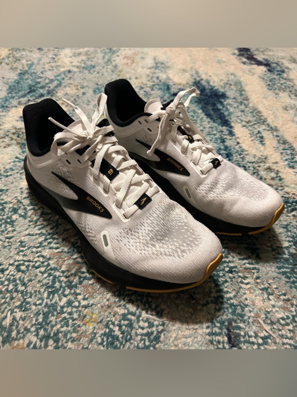 Brooks launch 9 women’s White Athletic Running Shoes with Black & Gold Details